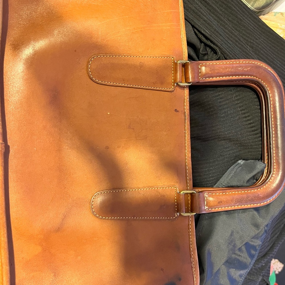 signs of usage,ink stains on the inner/outside with white stains in the inside